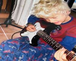 He likes playing the guitar as a kid.